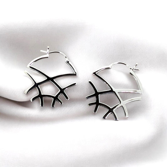 Sterling silver earrings feature a sophisticated French clasp design showcasing a captivating web of intersecting lines