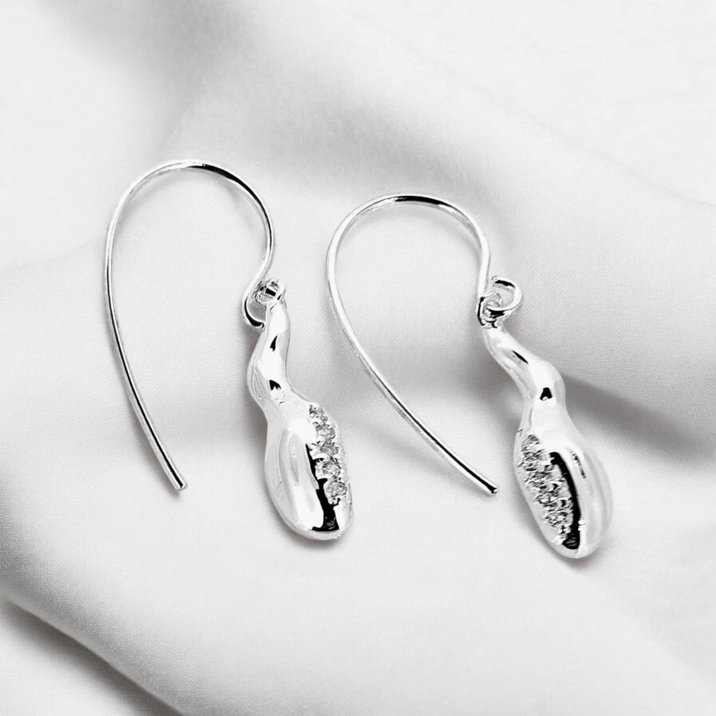 Jiwa hook sterling silver earrings in mottled style with a cluster of white topaz nestled at the front