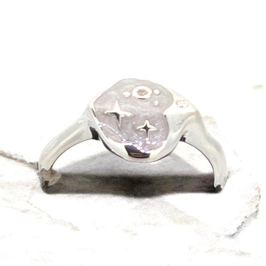 A uniquely shaped sterling silver setting designed to hold a striking piece of mother of pearl with an unconventional flair.