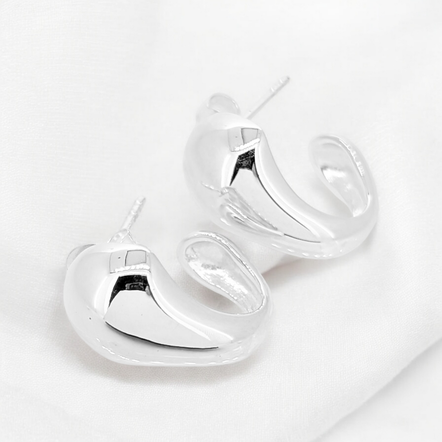 Sterling silver stud with wide bold front presence tapering underneath adds to the pizazz of these earrings