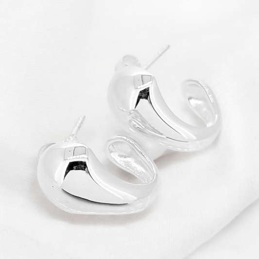 Sterling silver stud with wide bold front presence tapering underneath adds to the pizazz of these earrings