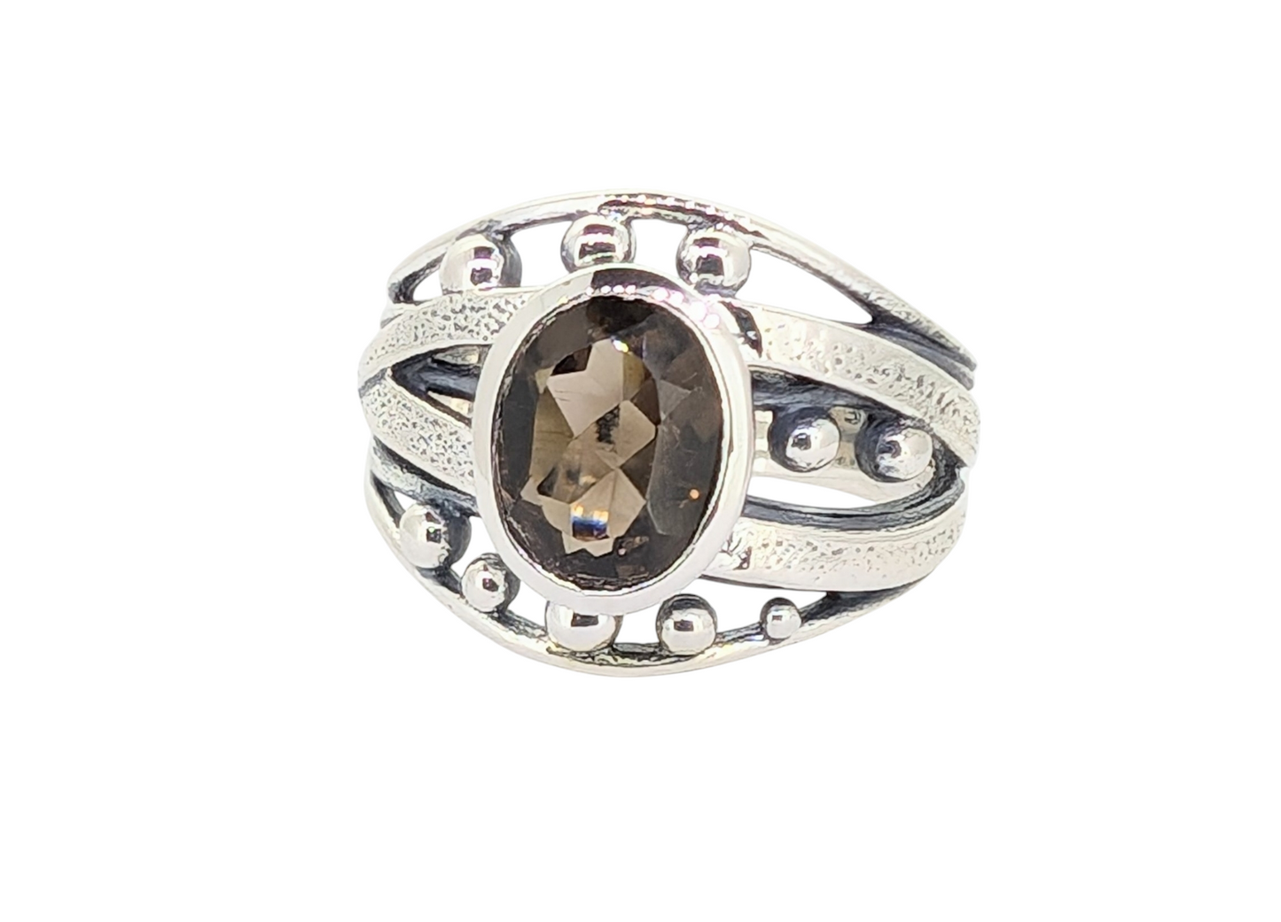 This bold Smoky Quartz ring is set in a striking web of sterling silver designed to evoke a fierce "warrior" aesthetic.